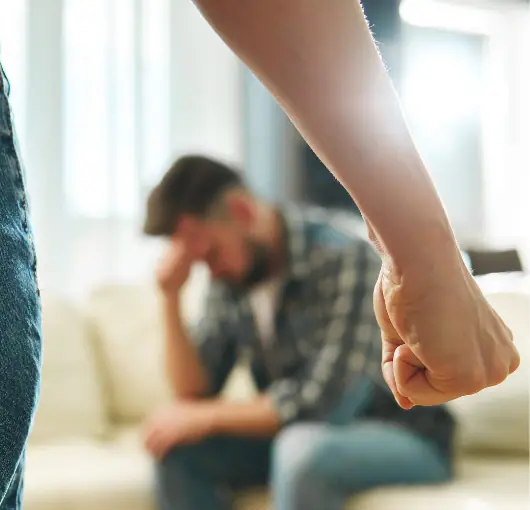 Person holding up a hand to signal stop