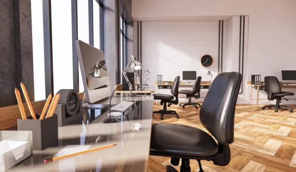 Empty office workstation with a computer and chair