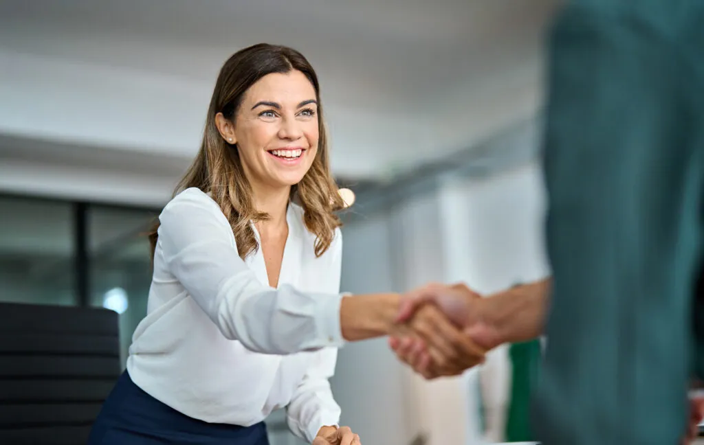 Woman shaking hands with a legal adviser