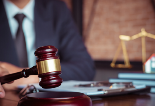 a gavel on a wooden block