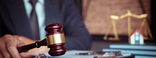a gavel on a wooden block