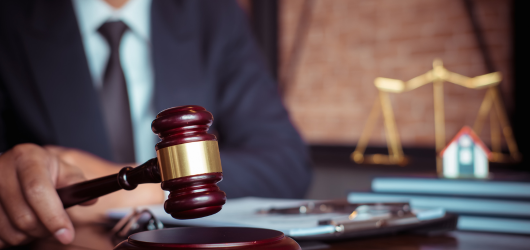 a gavel on a wooden block