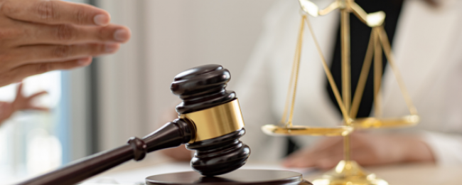 a gavel on a wooden block